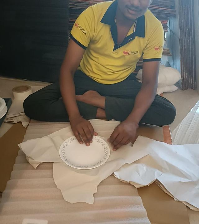 PN Writer packer wrapping crockery in paper