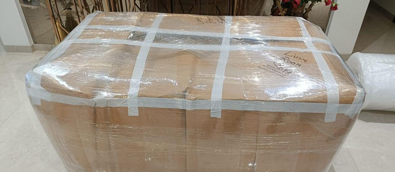 Sofa wrapped and labelled for a move