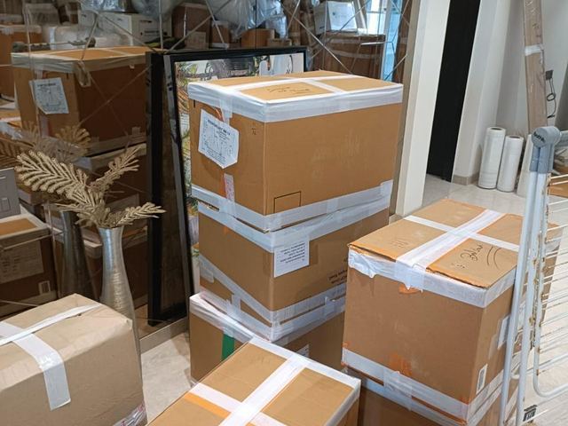 Cartons sealed and labelled for the move