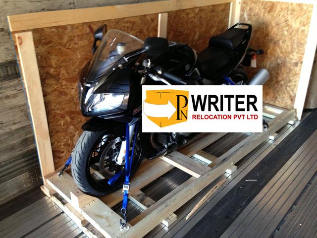 Motorbike secured in a wooden crate for transport